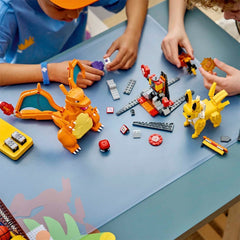 Children playing with colorful toy figures and building blocks on a table.