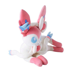Plush toy of a pink and white creature with large ears on a white background