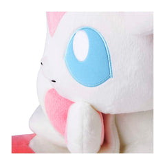 Close-up of a plush toy with a pink and white design on a white background