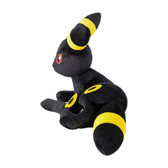 Black and yellow plush toy on a white background