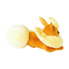 Plush toy resembling a dragon on a white background
