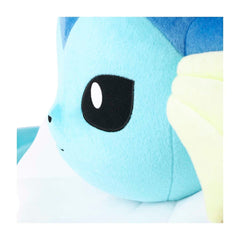 Close-up of a blue plush toy with a black eye and white face.
