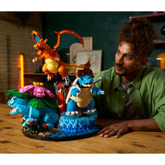 Man interacting with a colorful toy set on a wooden table